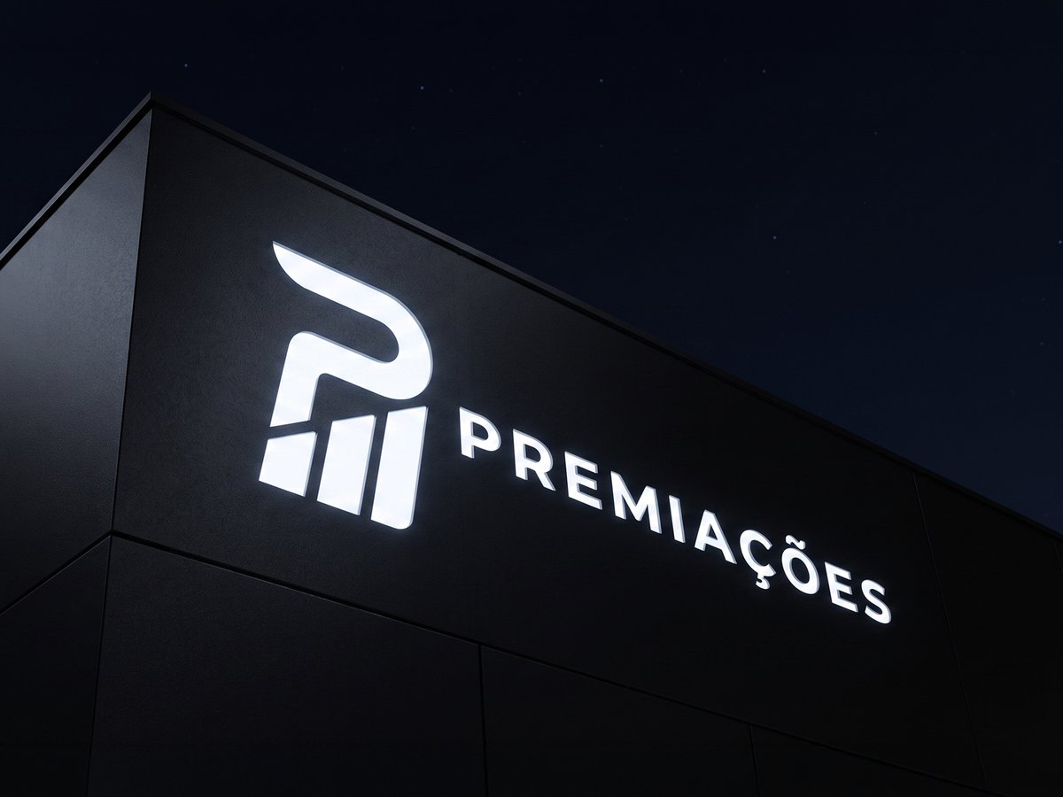 Fachada da Podium Premiações à noite, com o logotipo iluminado